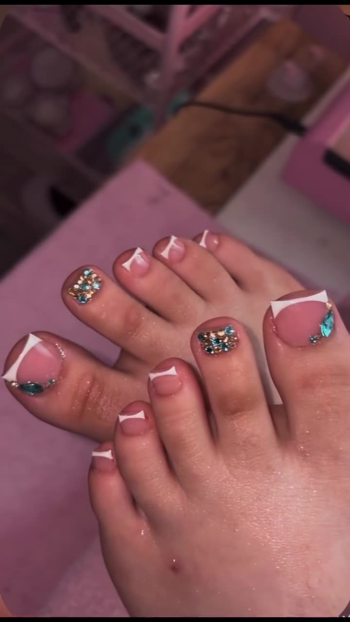 Pink French tip toes with rhinestones