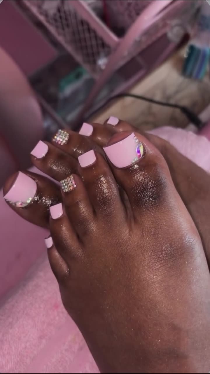 Toes with French tips and rhinestone accents